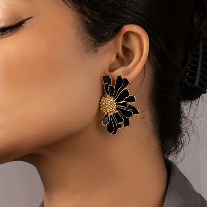 Boucles d’oreilles fleur noire dorée