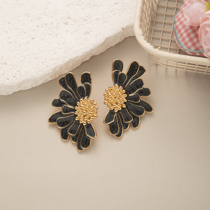Boucles d’oreilles fleur noire dorée