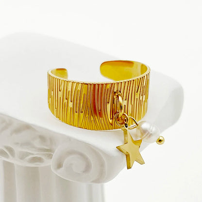 Bague vintage perle et étoile dorée